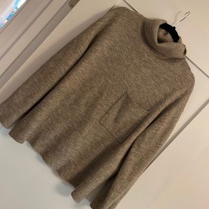 Boxy turtleneck sweater.